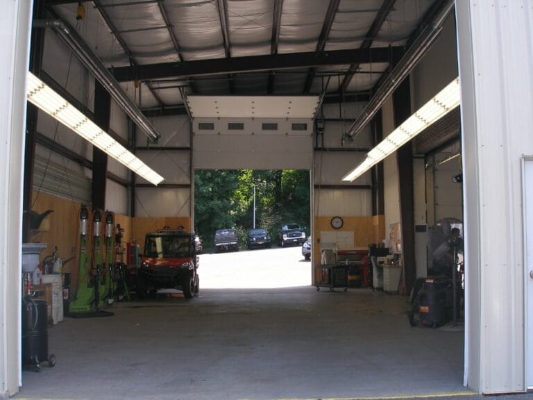 Interior service bay of a steel fleet maintenance shop